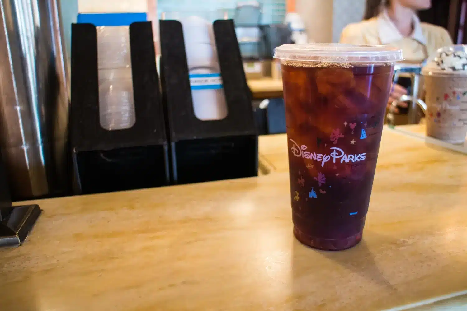 An Iced Coffee in a Disney Parks cup