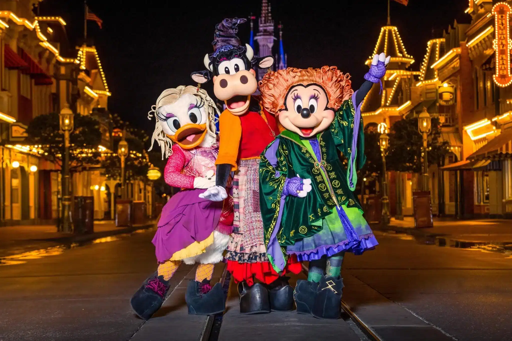 Minnie, Daisy, Clarabelle Cow as the Sanderson Sisters in the Boo To You Parade