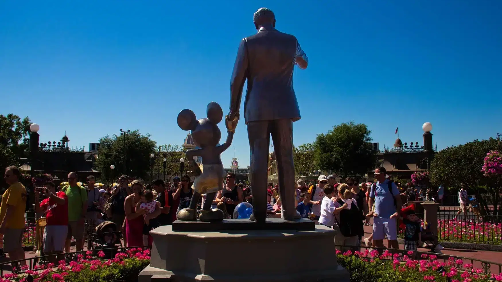 Partners Statue from behind - Magic Kingdom iconic statue of Mickey Mouse and Walt Disney holding hands facing Main Street USA