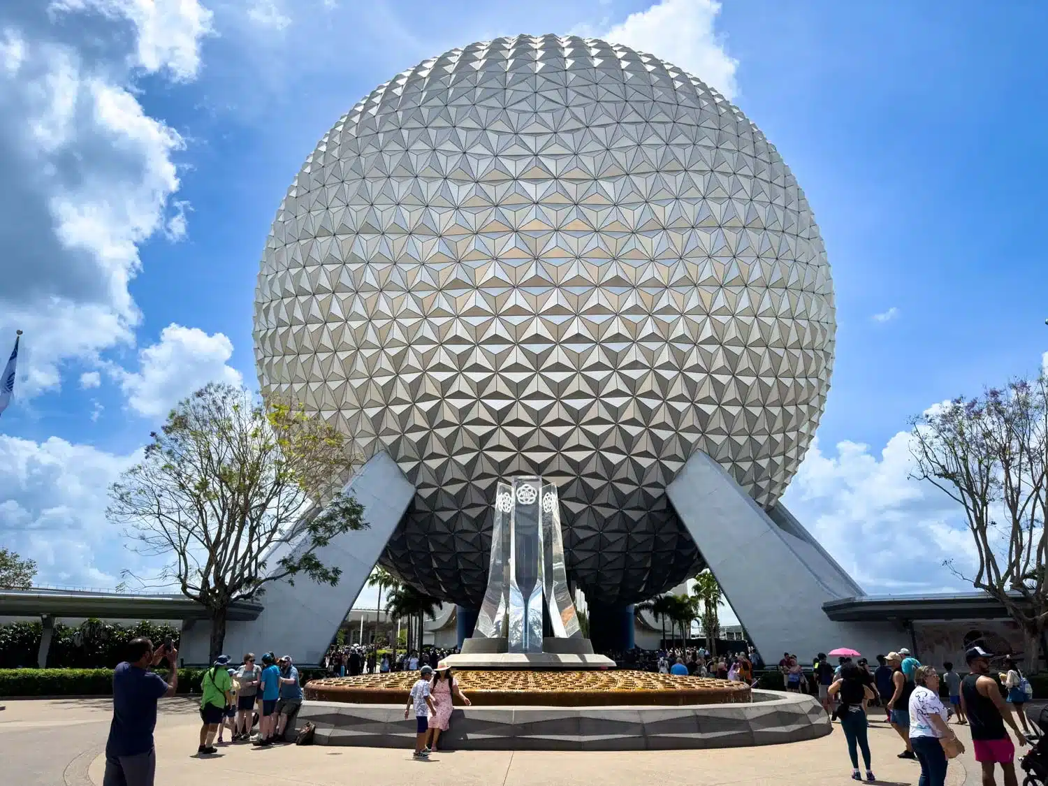 Spaceship Earth at EPCOT on a bright day with a blue sky